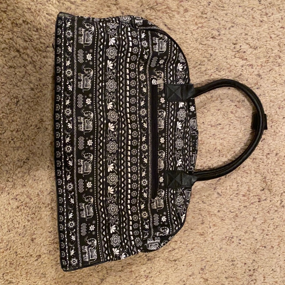 Medium size duffel bag with elephant print.